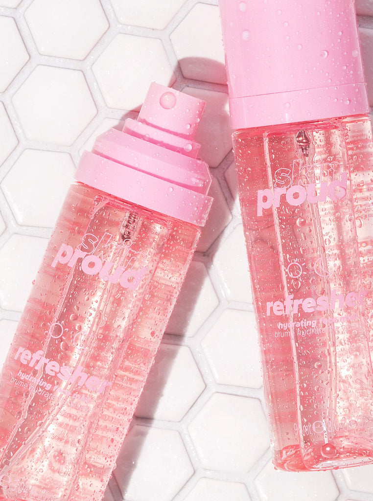 Two bottles of Skin Proud Refresher spray